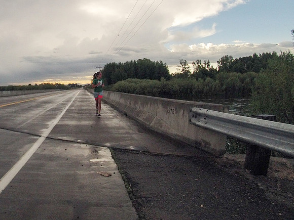 A runner passes Beaver Dick Park along highway 33.