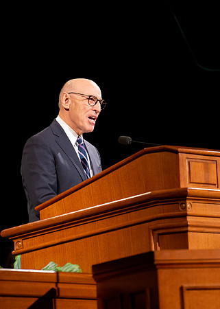 Elder Arnulfo Valenzuela giving a speech at the devotional.