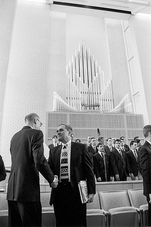President Steven D. Bennion and President Henry B. Eyring greeting each other at the dedication service of the Taylor Building