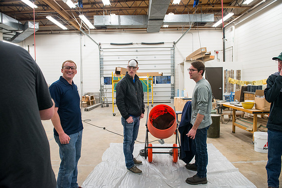 Civil engineering students work with different mixtures of cement to make a light, yet durable, cement that will be the building material for a canoe.