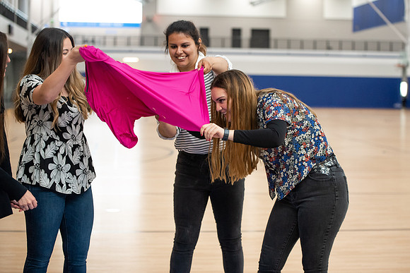 Student Support employees participate in team-building activities in the Hart Gym.