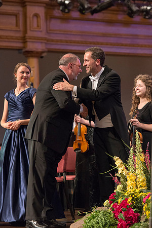 Compoer Daniel Gawthrop embraces Brigham Young University-Idaho's director after the Sacred Music concert. Photo by Ryan Chase