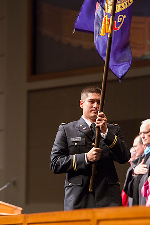 Newly commissioned 2LT Vogan posts the colors during the 2014 Spring Semester Commencement in the I-Center. Photo by Tyler Rickenbach