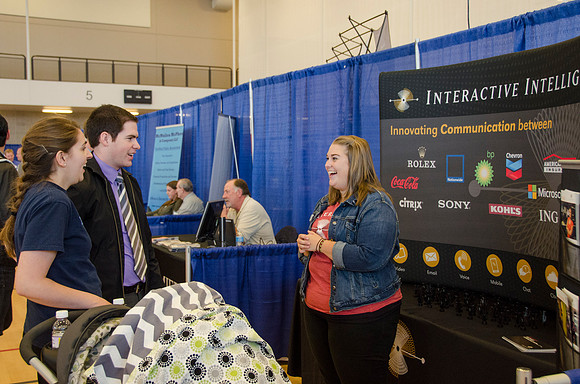 BYU-Idaho students speak to representatives from colleges or companies from their field of study at a career fair held in the I-Center gym