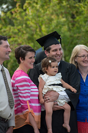Faculty, family and graduates around campus after the commencement ceremony.