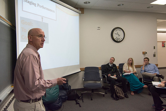Brother Clay converses with his students about staging performances in his Social Psychology class.