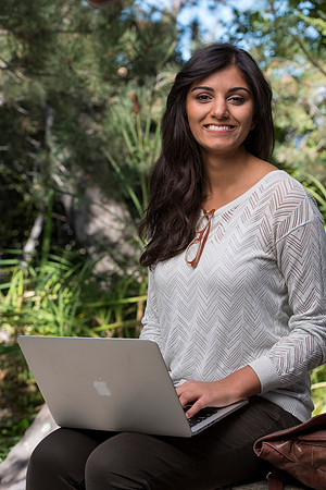Student Noor Sofi poses in the Gardens for online learning.