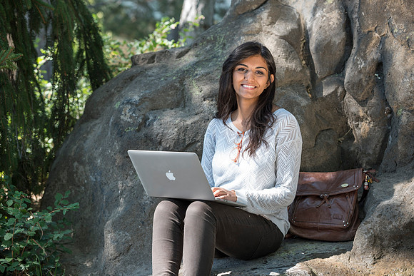 Student Noor Sofi poses in the Gardens for online learning.