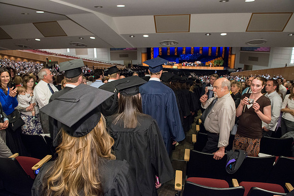 Graduates gather and march in during the processional for April 2014 Graduation ceremonies in the BYU-Idaho Center.