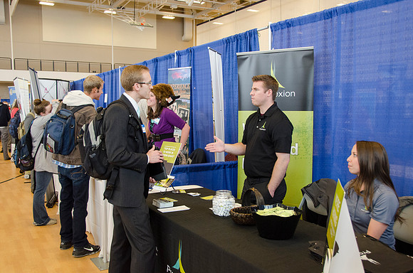 BYU-Idaho students speak to representatives from colleges or companies from their field of study at a career fair held in the I-Center gym