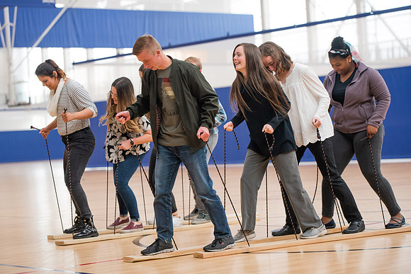 Student Support employees participate in team-building activities in the Hart Gym.