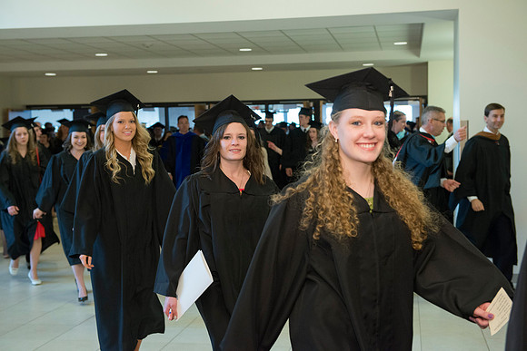Graduates gather and march in during the processional for April 2014 Graduation ceremonies in the BYU-Idaho Center.