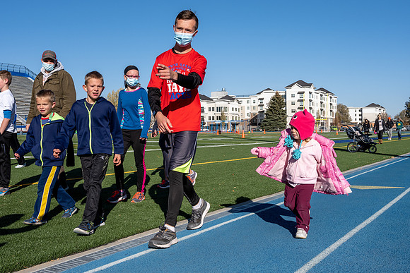 BYU-Idaho employees and their families enjoy a beautiful fall day at the stadium track.