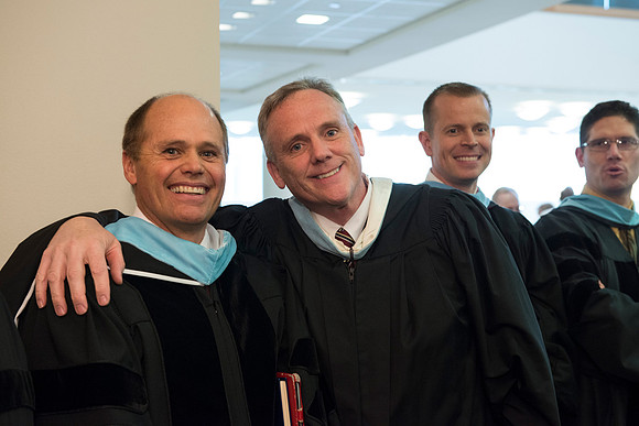 Graduates gather and march in during the processional for April 2014 Graduation ceremonies in the BYU-Idaho Center.