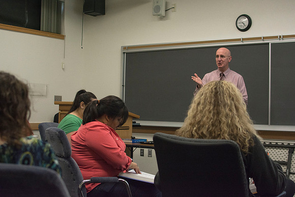 Brother Clay addresses a student's question in his Social Psychology class during the 2014 Spring Semester.
