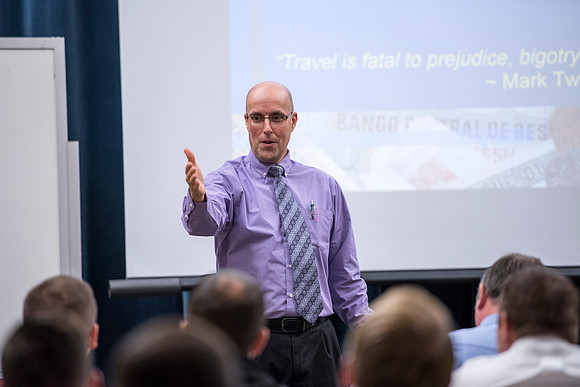 Jason Flora speaks at the faculty conference.