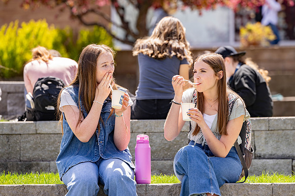 Spirit Fest Booths on campus, students talking and having fun together.