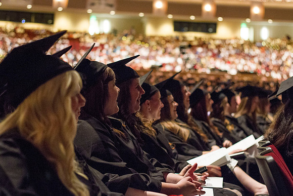 Students laugh at Sister Bonnie L. Oscarson's remarks, the Young Women General President, during the 2014 Spring Semester Graduation Commencement held in the I-Center. Photo by Tyler Rickenbach