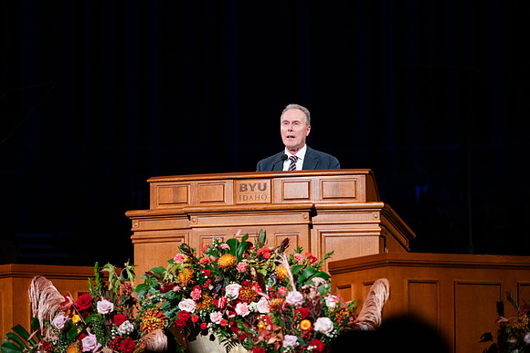 Elder and Sister Boom speak at devotional in the BYUI Center.