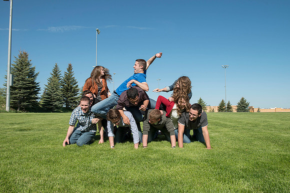 Student models interact and smile for marketing purposes that will be used for the new Campus Housing next to The Ivy.