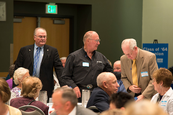 Alumni of the class of 1964 and earlier gather and honor the Briggs for their service.