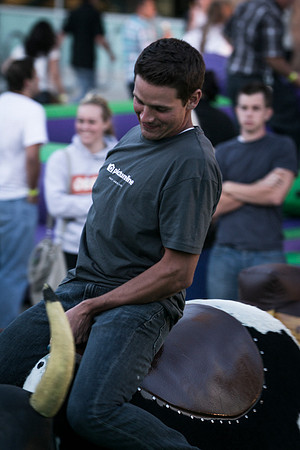Students test their ability to stay on top of a mechanical bull during the BYU-Idaho i-Night Extavaganza.