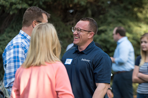 Pathway Worldwide employees and their families gather for a social in Rexburg. 2017