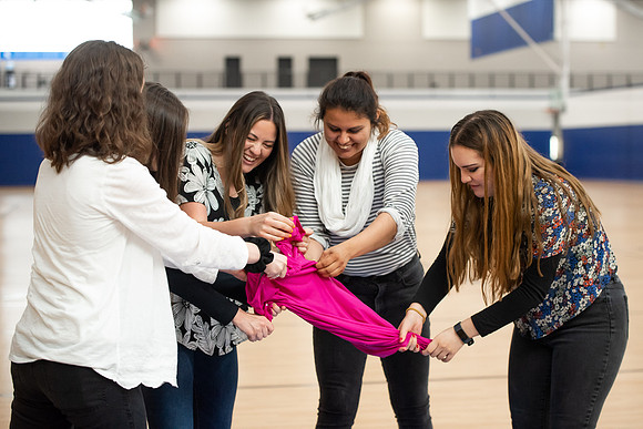 Student Support employees participate in team-building activities in the Hart Gym.