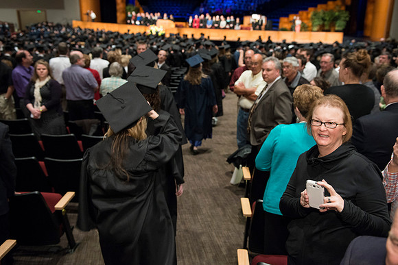 Graduates gather and march in during the processional for April 2014 Graduation ceremonies in the BYU-Idaho Center.