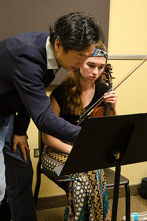 A member of the Shanghai String Quartet working with student ensembles.
