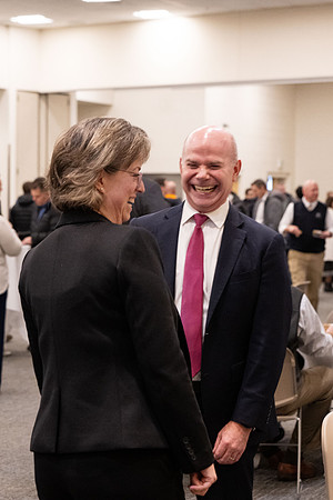 Employees gather for the annual Christmas gathering with President and Sister Meredith.