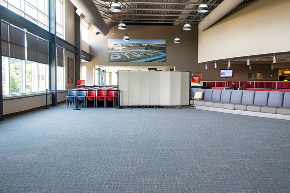 Tables and chairs stacked together so no one can use them during the Covid-19 Pandemic.