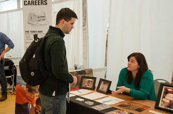 BYU-Idaho students speak to representatives from colleges or companies from their field of study at a career fair held in the I-Center gym