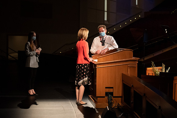 Amanda Kingsford speaks in devotional to an empty auditorium due to Covid-19 restrictions.