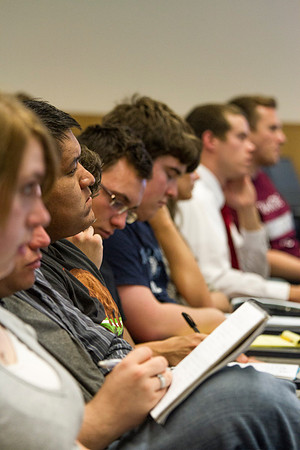 Students take notes as Brother Hyrum Lewis teaches American Foundations during the 2014 Spring Semester.