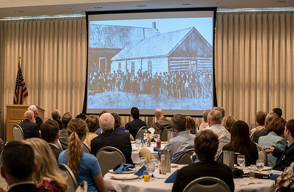 Alumni of the class of 1964 and earlier gather and honor the Briggs for their service.