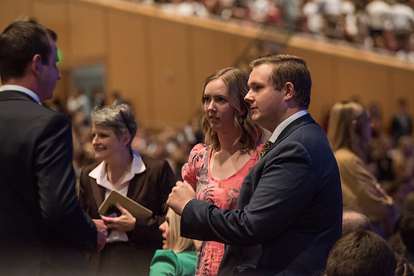 BYU-Idaho Devotional. Guest speaker Elder David A. Bednar and his wife. Students getting ready to listen. Fall Semester