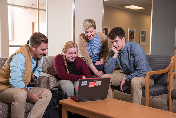 Information Technology students pose on campus for the department webpage.