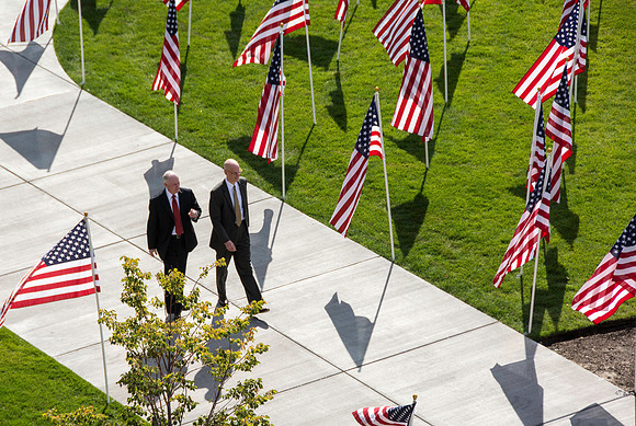 Flags on display in the Central Quad celebrate Constitution Day. President Clark and Eyring.
