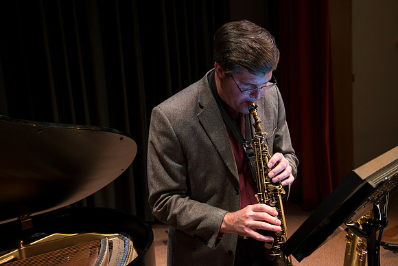 Mark Watkins on saxophone.