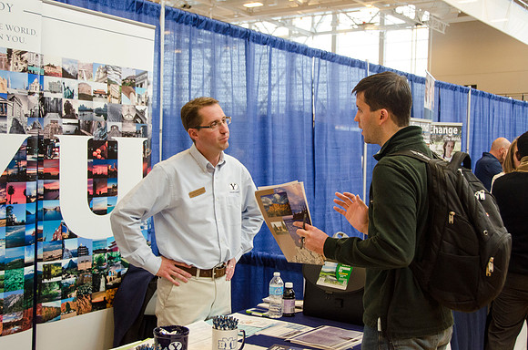 BYU-Idaho students speak to representatives from colleges or companies from their field of study at a career fair held in the I-Center gym
