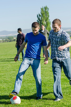 A group of students play a friendly game of soccer.