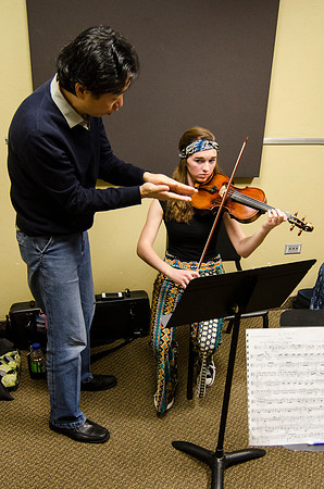 A member of the Shanghai String Quartet working with student ensembles.