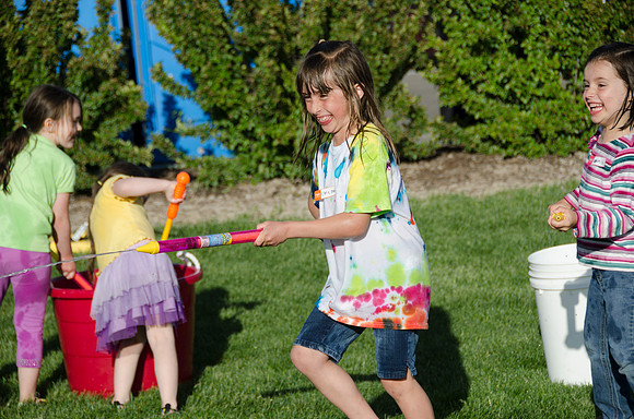 Online instructors gather with their families for an eveing of BBQ and games.