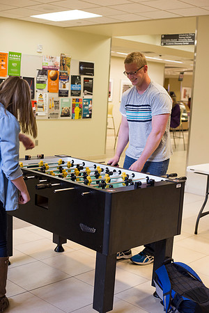 Students playing fuseball between classes.
