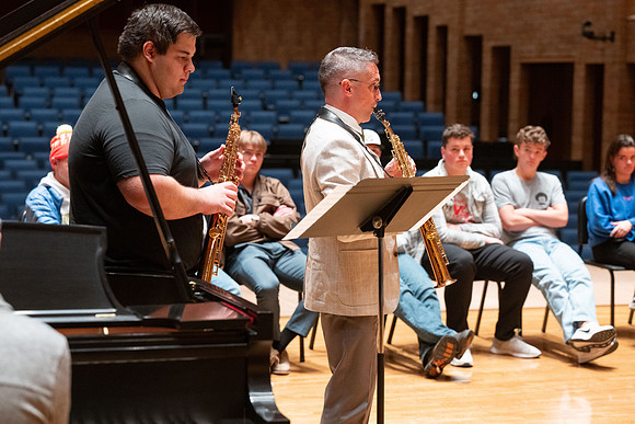 Members of the United States Marine Band work with students in a Masters class.