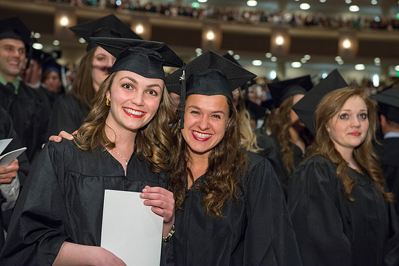 Graduates gather and march in during the processional for April 2014 Graduation ceremonies in the BYU-Idaho Center.