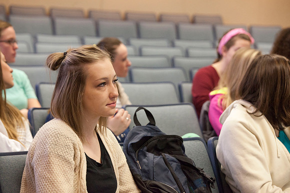 A student listens intently as Brother Madsen teaches his early morning Geography class.