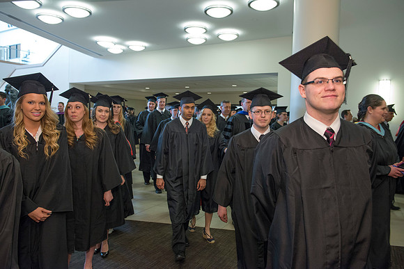 Graduates gather and march in during the processional for April 2014 Graduation ceremonies in the BYU-Idaho Center.