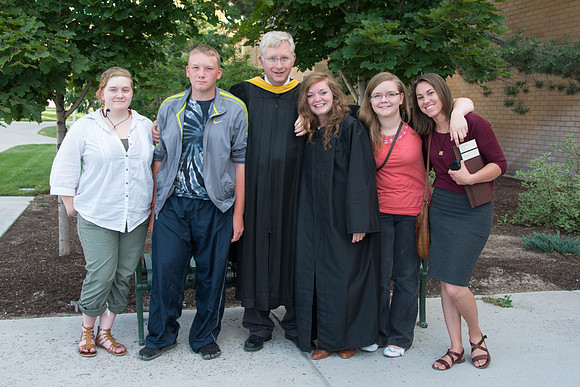 Faculty, family and graduates around campus after the commencement ceremony.